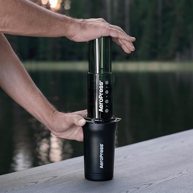 AeroPress Stainless Steel Travel Coffee Tumbler - Double-Wall Insulation for Hot or Cold Drinks with a Splash-Resistant Lid and Built-In Filter Storage, Cup Holder Friendly - 16 oz, Black